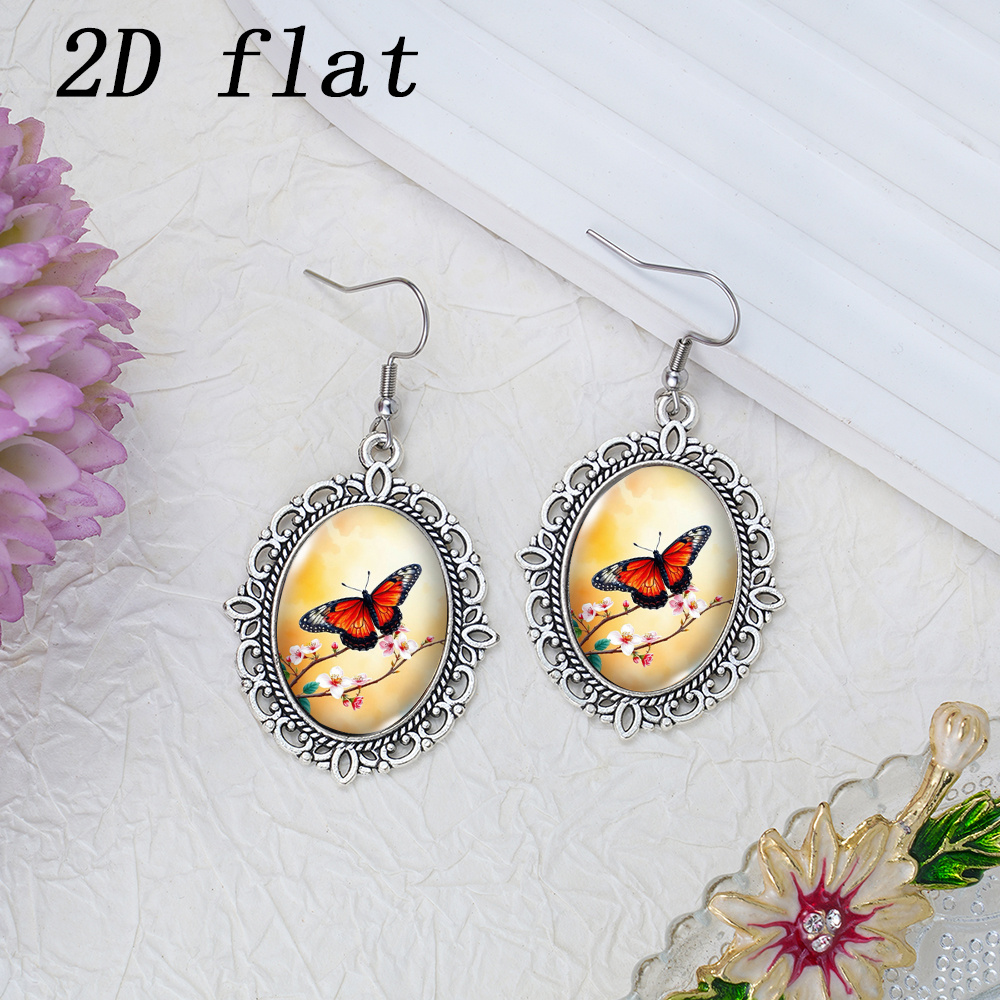 Warm Orange Glow Butterfly Flower Branch Pattern Glass Earrings